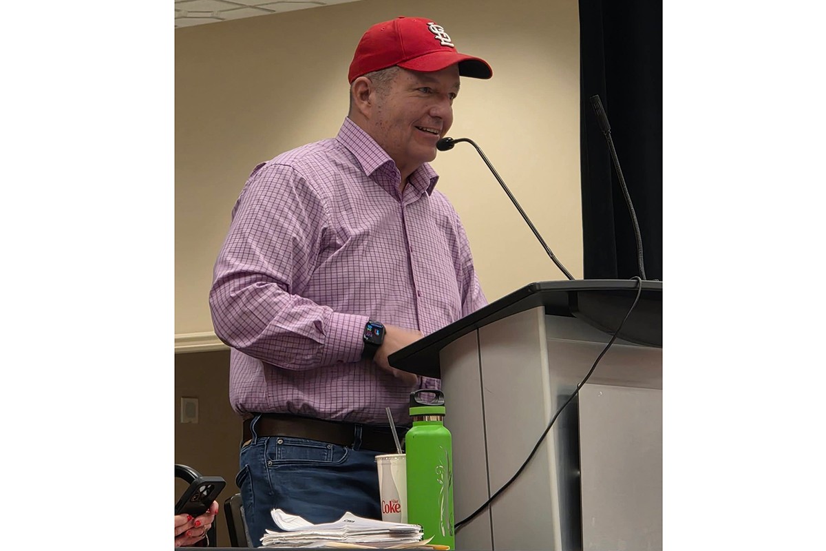 Will Westmoreland speaks from a lectern