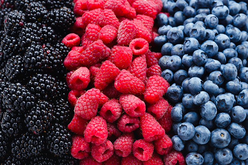 Blackberry, raspberry, blueberry background. Top view.