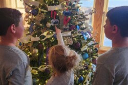 Johnson kids decorating the Christmas tree