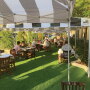 When indoor dining was banned once again in California restaurants due to a surge in coronavirus cases in July, foodservice operators were forced to get creative to keep their businesses afloat. At Milton’s deli in Del Mar, Calif., seven parking spaces in front of the restaurant were covered with artificial turf, and 20 shaded tables were set up, treating diners to al fresco dining. “We’re just trying to make the best of this moving target,” says owner Barry Robbins. “As far as customer experience, it’s been very positive,” he says. “People feel safer outside.”