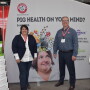 Ellen Davis, ARM & HAMMER swine technical services manager, (left) and Steve Larsen, Passport Food Safety Solutions, (right) welcome attendees of the Iowa Pork Congress.