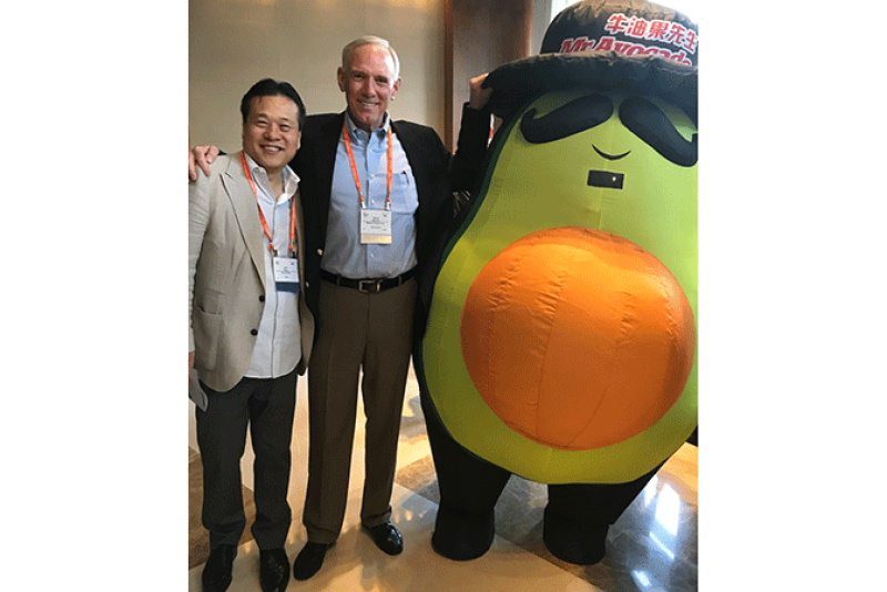 John Wang, CEO of Lantao (left), and Mission Produce President and CEO Steve Barnard, with Mr. Avocado brand mascot Mr. Avocado, at the Produce Marketing Association’s recent Fresh Connections event in Shenzhen, China.