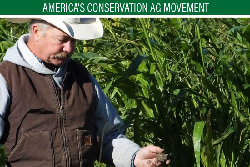 Doug Sieck examines soil from his crop field during a field day at his farm near Selby, S.D. Sieck said deep-rooted cover crops have helped build carbon in his soil, making it capable of handling water in wet years.
