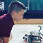 Hunter looking at robot