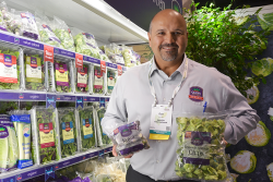 Hundreds of Fresh Summit exhibitors donated food from Fresh Summit expo booths to Florida food banks. Dan Canales of Ippolito International, shows off Royal Brussels sprouts and Brussels sprouts chips.