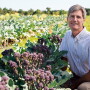 Thomas Bjorkman, professor of horticulture at Cornell University poses with an heirloom style broccoli he is researching to understand available broccoli genes for breeding purposes.