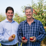 Left to right, Don Roper, vice president sales and marketing, Fred Wescott, president, Honeybear Brands in one of Honeybear’s many varietal development grower orchards