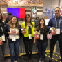 Helen Aquino, director of brand marketing and communications for Village Farms, (second from left) said the Heavenly Villagio Marzano variety was the focus of attention at the company's Produce Marketing Association Fresh Summit booth.