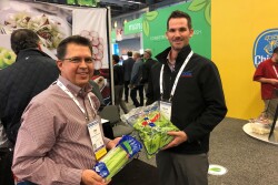 Tim Ross (left), director of regional sales for Duda Farm Fresh Foods, Salinas, Calif., and Mason Hamilton, account manager for the company, display celery at the 2019 CPMA Expo Floor.