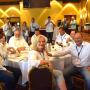 Paula Houlihan, front-center, and Wisconsin Potato & Vegetable Growers Association executive director Tamas Houlihan, right, enjoy festivities at the National Potato Council summer meeting in July in Wisconsin Dells, Wisc.