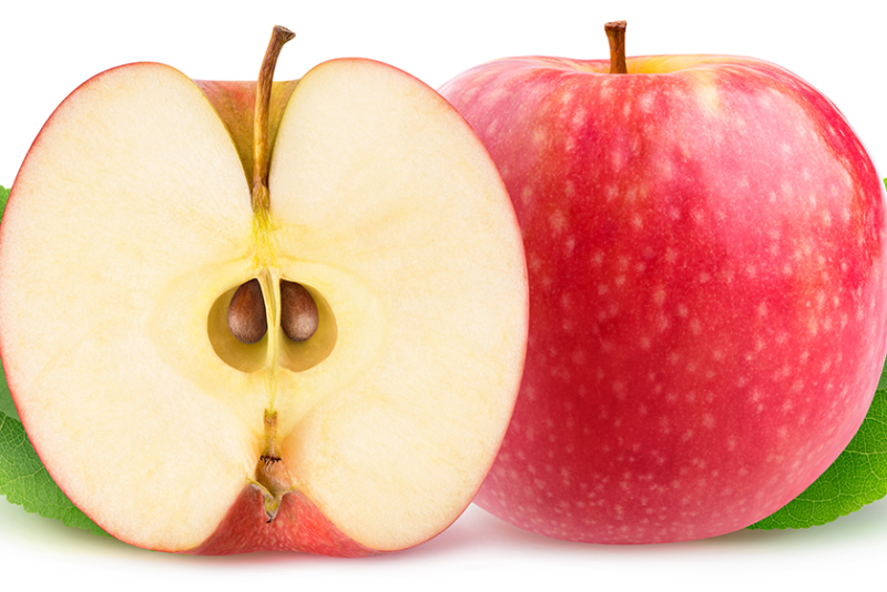 The inside of a half on an apple on the left faces the front, and a whole red apple is on the right.