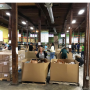 Allen Lund Co. employees help package food for Feedmore in Richmond, Va.