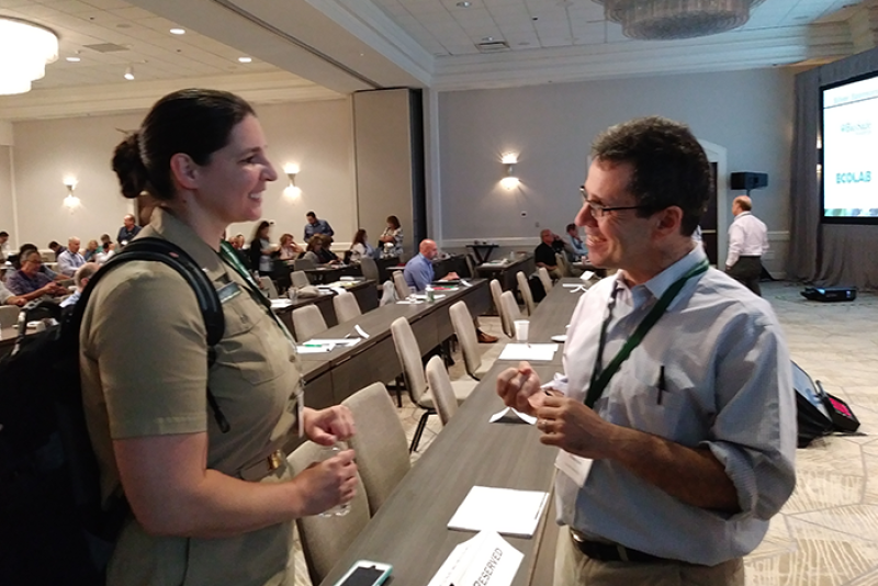 Kari Irvin, deputy director of the Food and Drug Administration’s Coordinated Outbreak Response and Evaluation Network, talks with Cornell University professor Martin Wiedmann after Irvin's presentation on the difficulties of tracing the source E.coli in leafy greens at the Center for Produce Safety's Research Symposium in Charlotte, N.C.