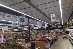 A grocery store produce department with Georgia Grown signage