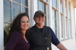 Flanked by the 1928 schoolhouse, Aaron is the face of Base Vines & Cattle side-stream ventures and Jennifer is the logistical captain.