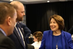 Sen. Amy Klobuchar (right) speaks with pork producers in Washington, D.C.