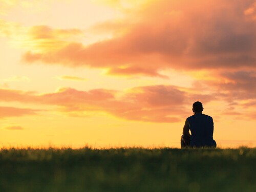 Farmer and sunset iStock