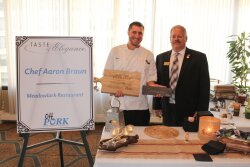 Ohio Pork Council President Dave Shoup presents Chef Aaron Braun with the Chef Par Excellence Award and People's Choice Award. Braun has been awarded the People's Choice Award for two consecutive years.
