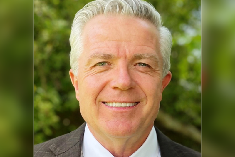 Portrait headshot of a man smiling