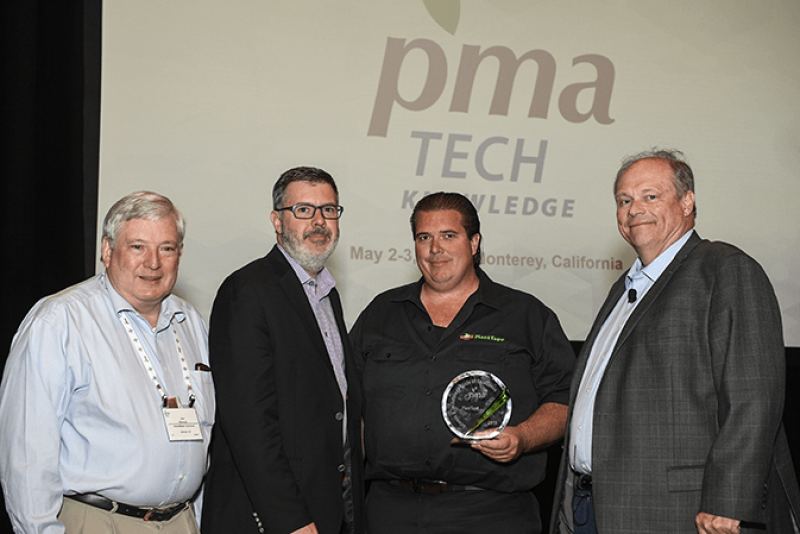 PlantTape received the 2018 PMA Science & Technology Circle of Excellence award. Jeff Antle of PlantTape (center right), receives the award, presented by Bob Whitaker of PMA (right), Andy Kennedy of FoodLogiQ (center left) and Jim Brennan of SmartWash Solutions.