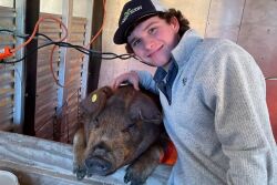 Myles Lee and his Duroc pig Doug