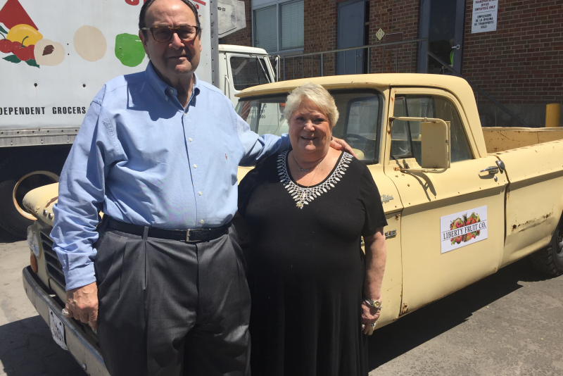 Arnold Caviar and his wife Carol stand in front of his 1965 Dodge truck that he used to peddle produce more than 40 years ago. Caviar retired as Liberty Fruit CEO May 18.