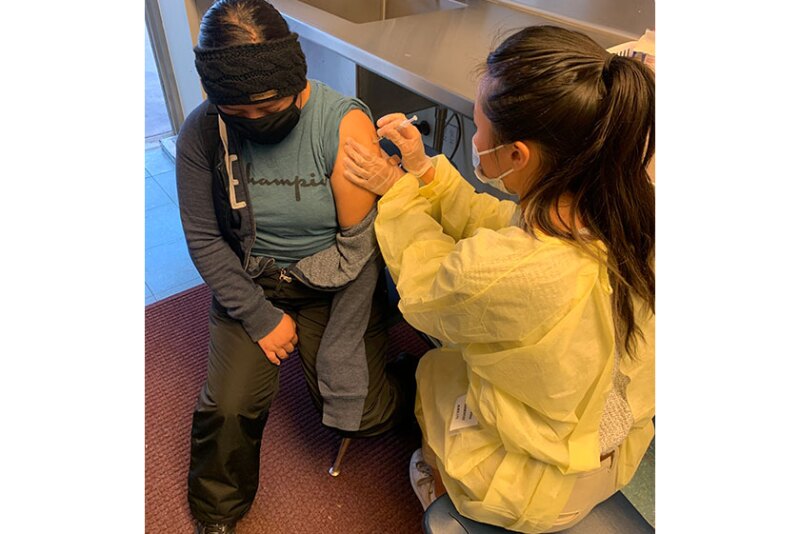 Pictured on the left, Daisy Gonzalez received the COVID-19 Vaccination after her shift.