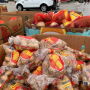 Produce shippers have been donating to excess produce to food banks as they wait for COVID-19 federal relief programs to begin. In the picture, potatoes and other produce are distributed at a Houston neighborhood.
