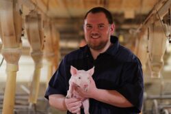 Logan Thornton with piglet