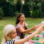 three people cheers picnic