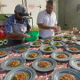 A local chef and Efron David Robles create plates of food.