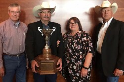 Drovers editorial director Greg Henderson (left) and BIF President Joe Mushrush (right) of Strong City presented the award to Kent and his wife, Jean. The award was sponsored by Drovers.  
