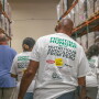people with Fight Hunger t shirts in a warehouse