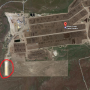 A view of the waste water pit at Wilson Creek Cattle Feeders via Google Maps circled in red.
