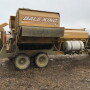 This bale processor, modified with a spray system for applying liquid supplement, allows a rancher to feed a measured dose of Rumensin to gestating cows.

