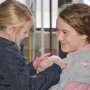 Harper and Olivia Shike with piglet
