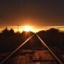 railroad train tracks sunset by Lindsey Pound