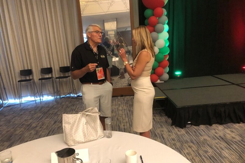 Bill Borton, director of farming operations for Borton & Sons, Yakima, Wash., visits Aug. 23 with Kaari Stannard, president of New York Apple Sales, Glenmont, N.Y., and chairwoman of the U.S. Apple Association, after the close of the U.S. Apple Association Crop Outlook & Marketing Conference in Chicago. 