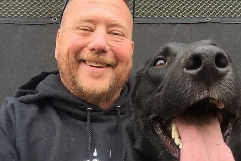 Colorado State University researcher Dr. Glen Golden and Odin taking a break from detector dog training.
