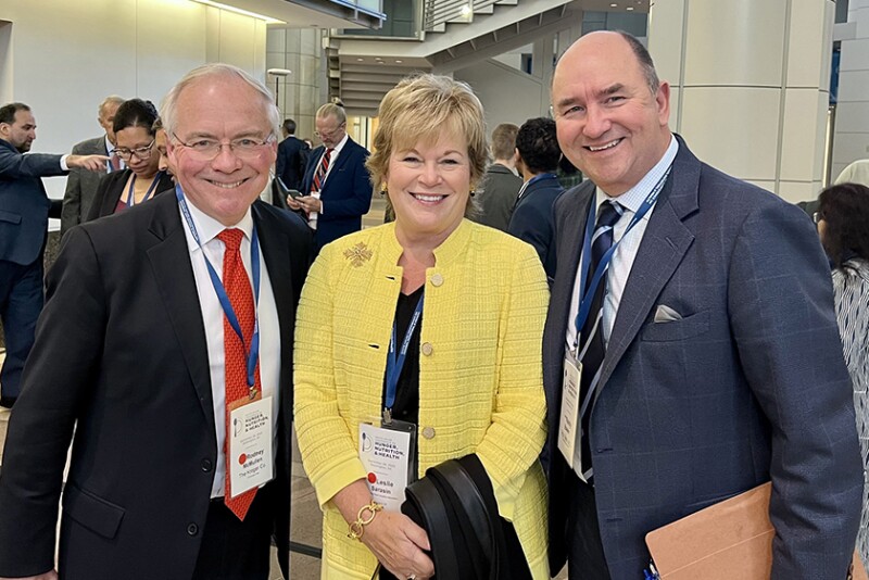 Three individuals stand together: FMI President and CEO Leslie Sarasin at the White House Conference. She is joined by Kroger CEO Rodney McMullen (left) and Hy-Vee Chairman Randy Edeker (right)