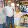 New Jersey Secretary of Agriculture Douglas Fisher (center) visits Russo’s Fruit and Vegetable Farm owners Anthony and Melissa Russo, who have a Jersey Fresh blueberry display in their farm market in Tabernacle.