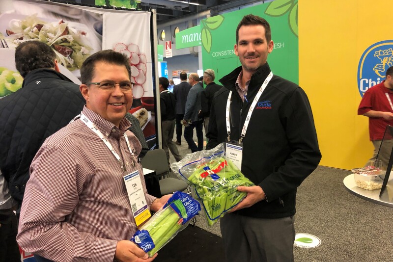 Tim Ross (left), director of regional sales for Duda Farm Fresh Foods, Salinas, Calif., and Mason Hamilton, account manager for the company, display celery at the 2019 CPMA Expo Floor.