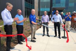 A ribbon-cutting ceremony marked the grand opening of the new Syngenta facility. Warren Kruger, head of field crops seeds development for North America did the honors. With him, from left to right, are Erik Fyrwald, CEO, Syngenta Group; Eric Boeck, regional director North American seeds; Trevor Hohls, global head of seeds development; and Justin Wolfe, president global seeds.