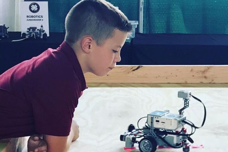 Hunter looking at robot