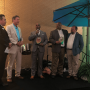 Perno W. Young III of ShopRite accepts the Mango Retailer of the Year award with his colleague Derrick S. Jenkins (second from right), who is standing with Lance Jungmeyer of the Fresh Produce Association of the Americas. The award was presented by Manuel Michel and Michael Warren of the National Mango Board. 