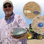 Mississippi producer Bernie Wright holds a hefty Native American celt  found jutting out of a field this past spring. To the right are pictures of a Civil War-era bullet and an old marble.