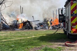 Firefighter fighting barn fire