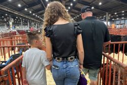 Briggs Yantis, Olivia Shike and Brandon Yantis at the National Junior Summer Spectacular pig show in Louisville, KY