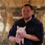 Logan Thornton with piglet