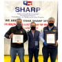 Carlos Bon (from left), vice president of sales at Divine Flavor; Jose Antonio Martinez, general manager; and Alan Aguirre, president and CEO, at a ceremony celebrating the company's health and safety management systems.